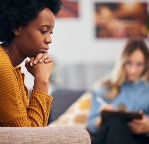 Mental health, depression and psychology with a black woman in therapy, talking to a professional. Anxiety, stress or support with a young patient in session with a psychologist for grief counseling.